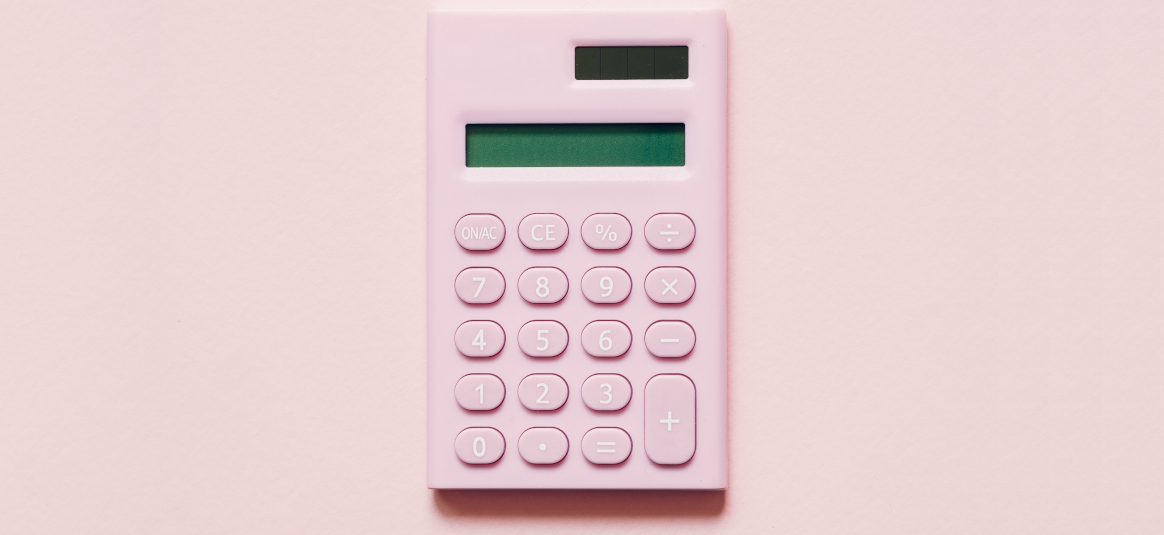 Photo of a pink calculator on a pink background